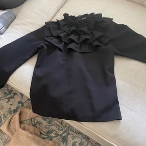 Black shirt with ruffle on the front and zipper on the black  IN 14 OR 16